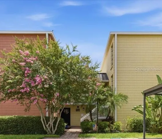 Welcome home! This condo's assigned parking spot is directly in front of the paved walkway leading to the front door.