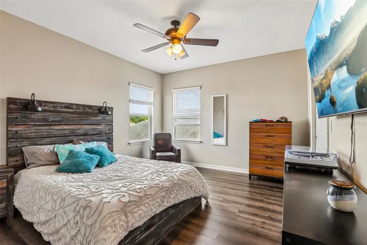 Bedroom 4 with new laminate flooring, walk in closet and ensuite bathroom