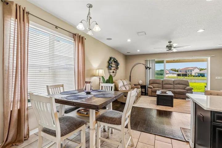 Dinette area, off the kitchen, with open floor plan and view to back yard