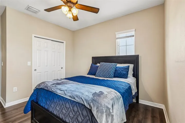 Bedroom 2 with laminate new laminate flooring,  large closet and access to jack and jill bathroom