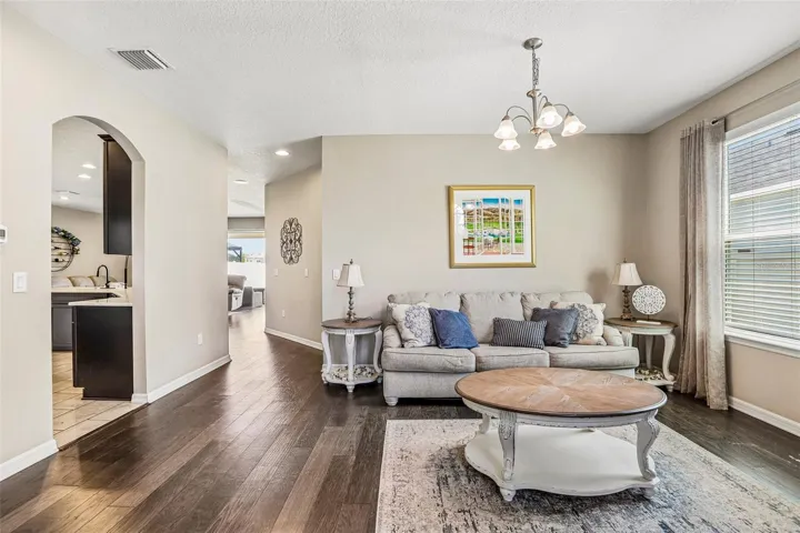 Inviting Living Room with hard wood floors and neutral colors
