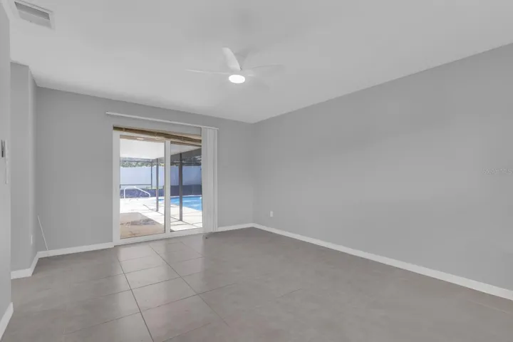 Primary Bedroom with Access to Pool Area.