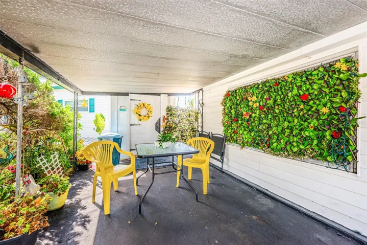Carport with extra space for seating and shed