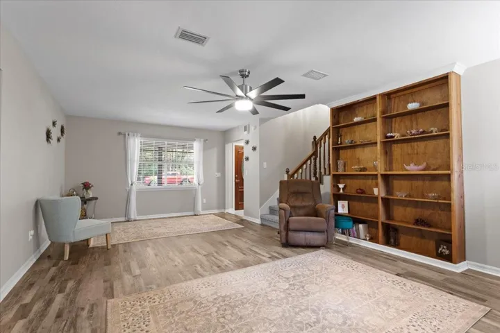 Living room with custom wood built-ins.