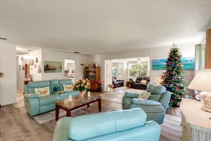 Enjoy an open, flowing floor plan that connects multiple living spaces, giving everyone room to relax. The seamless transition from the main living room to the lake-view sunroom creates an ideal layout for entertaining while filling the home with natural light and beautiful views.