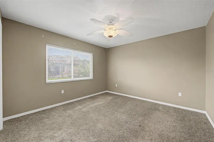 Spacious third bedroom featuring a comfortable layout, abundant natural light, and ample closet space.