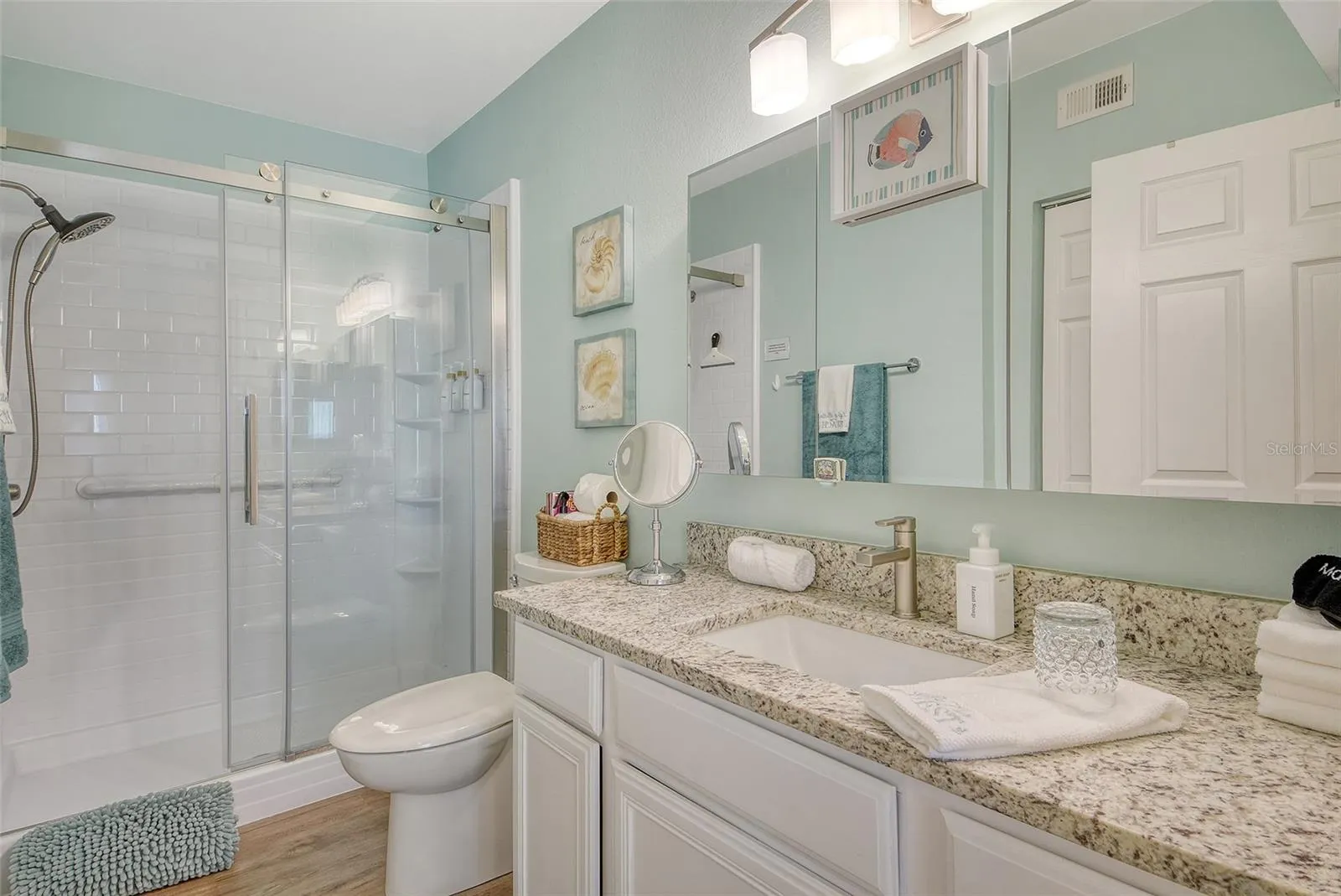 Primary bath with granite tops and shower