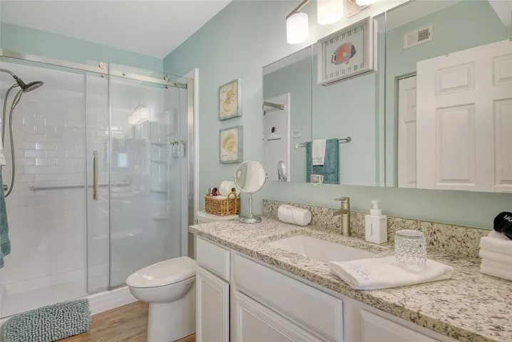 Primary bath with granite tops and shower