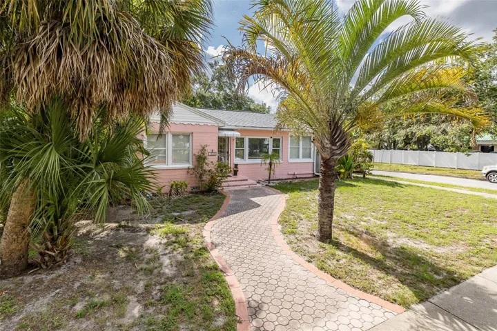 Front of Home featuring Pavered Walkway