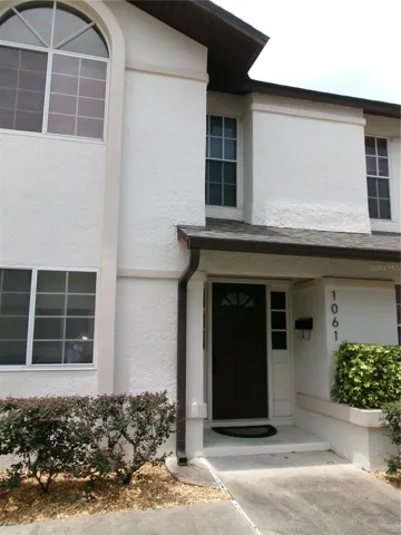 Two story stucco home with private entrance