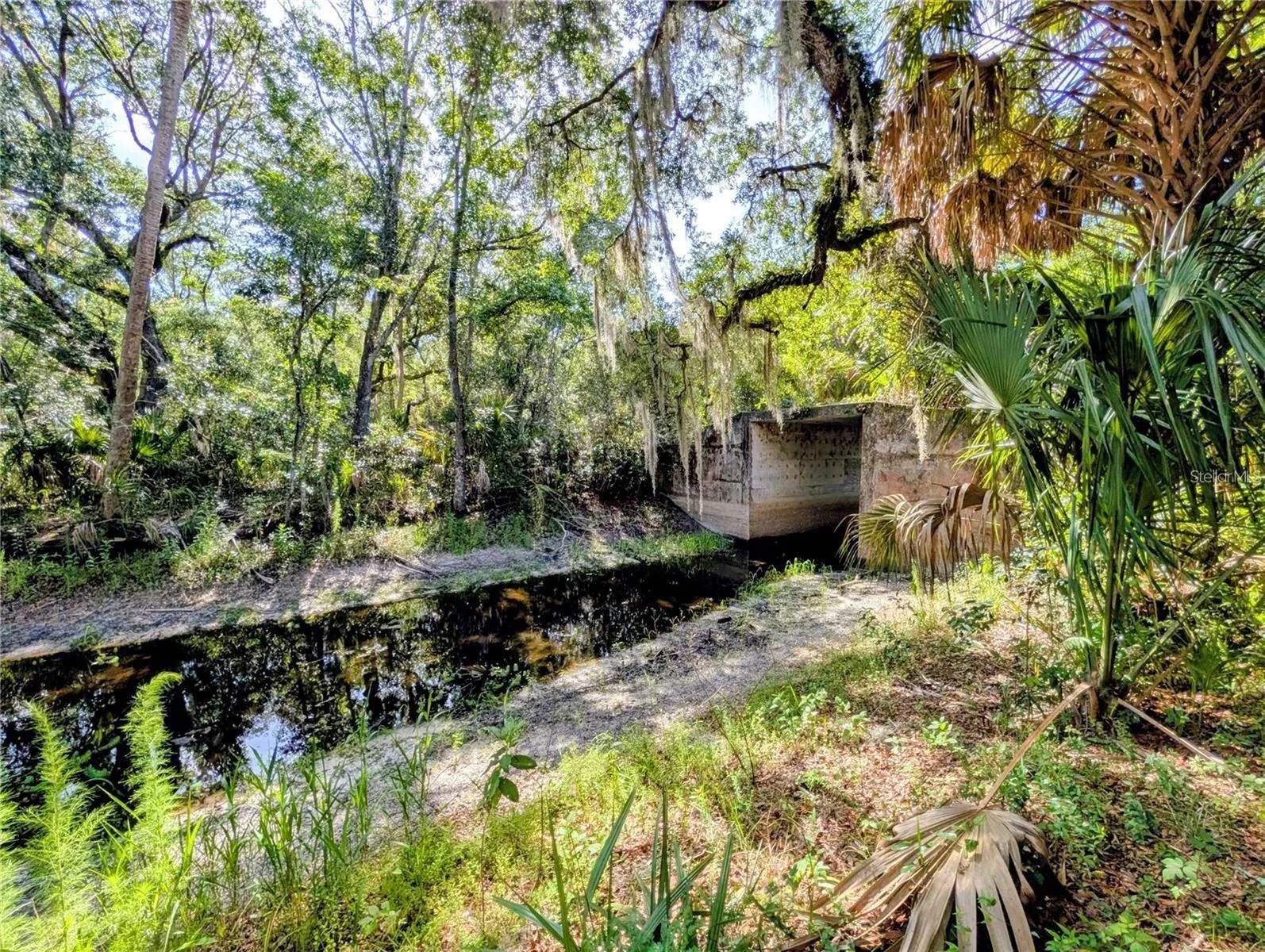 A bridge was permitted and built with room for passage of one boat under. Bridge connects the mainland to the island of abt 20 acres.
