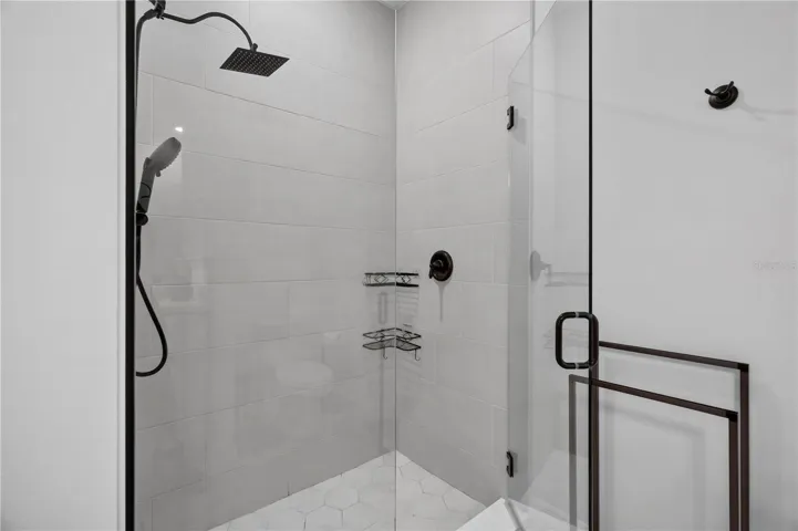 Primary Bathroom with walk-in glass shower enclosure