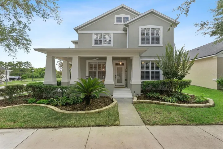 front covered porch that Charming Covered Wraparound Front Porch Extends Along the Left Side of the Home