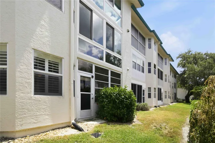 Rear of condo with door way right into greenspace.