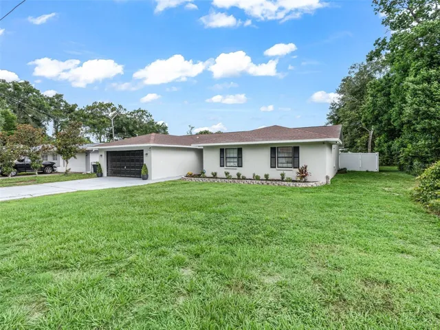 Front elevation of this 4 bedroom, 2 bath POOL HOME in Inverness, Florida!
