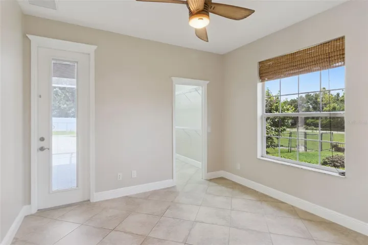 Bedroom 2 with walk in closet and door leading out to screend porch