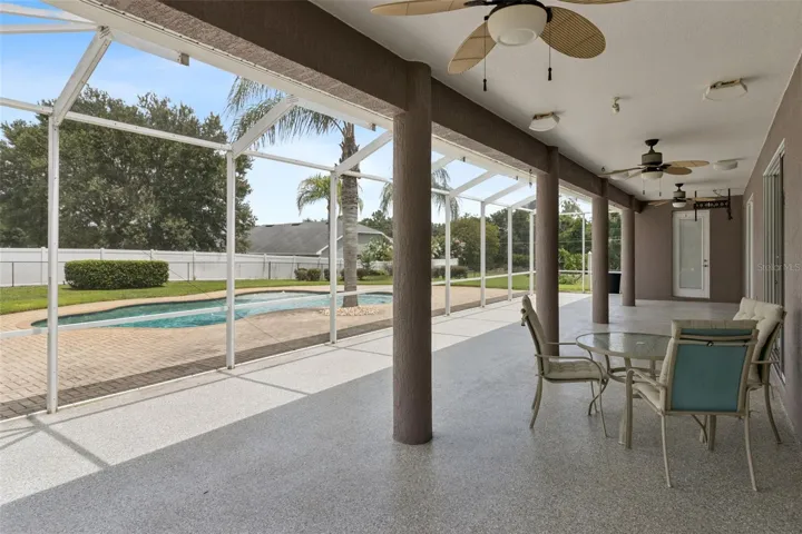 Screened porch overlooking pool &amp; backyard