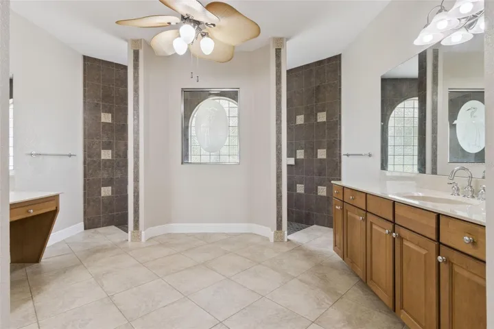 Primary bathroom with dual vanities