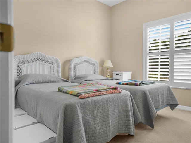 2nd Bedroom with Plantation Shutters and Carpet