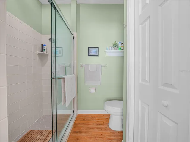 Shower with Glass Enclosure and Linen Closet