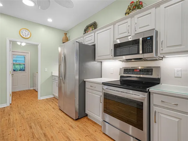 SS Appliances and Kitchen with Quartz Backsplash