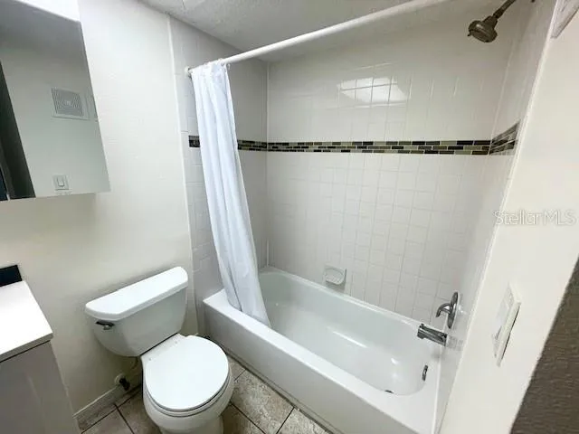 The full bathroom includes tub/shower combination and single sink vanity.