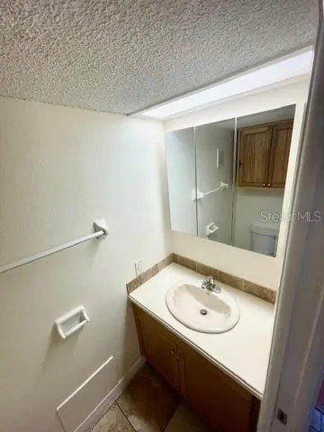 Guest half bathroom with single vanity