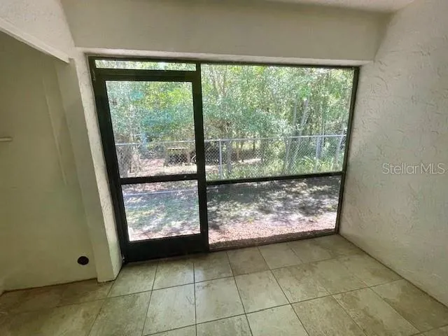 Screen enclosed rear lanai includes washer and dryer hookup.
