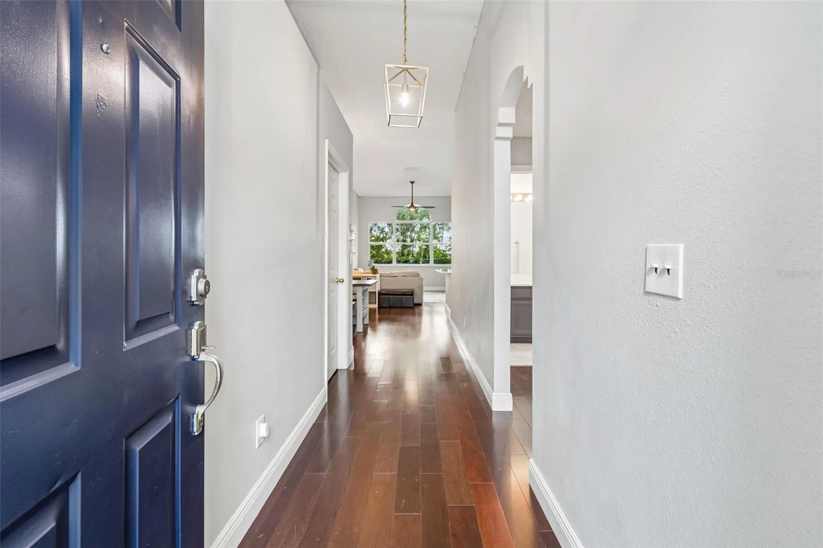 Engineered hardwood floors flow through main living spaces