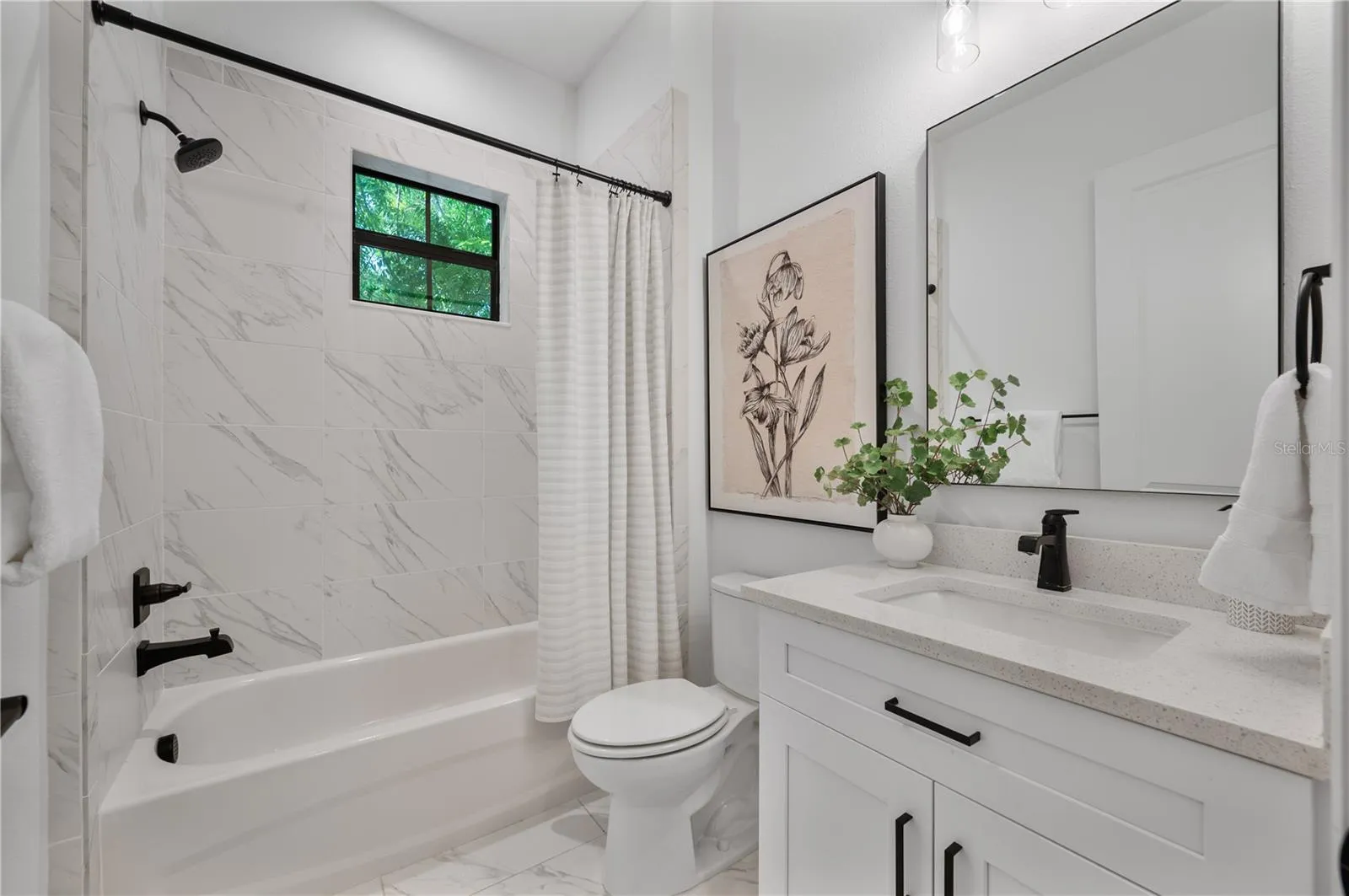 Downstairs full bathroom off entry