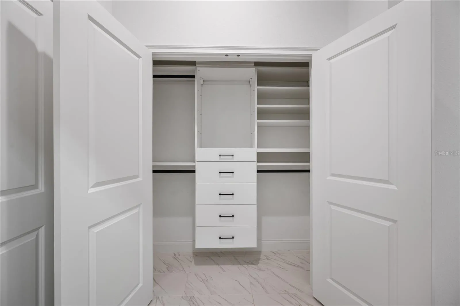 Second primary closet with California Closets system