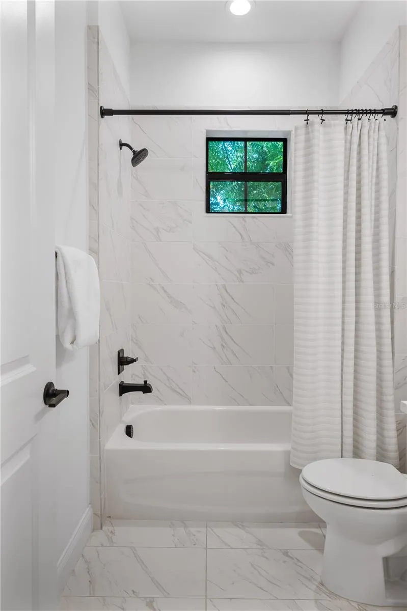 Downstairs full bathroom off entry