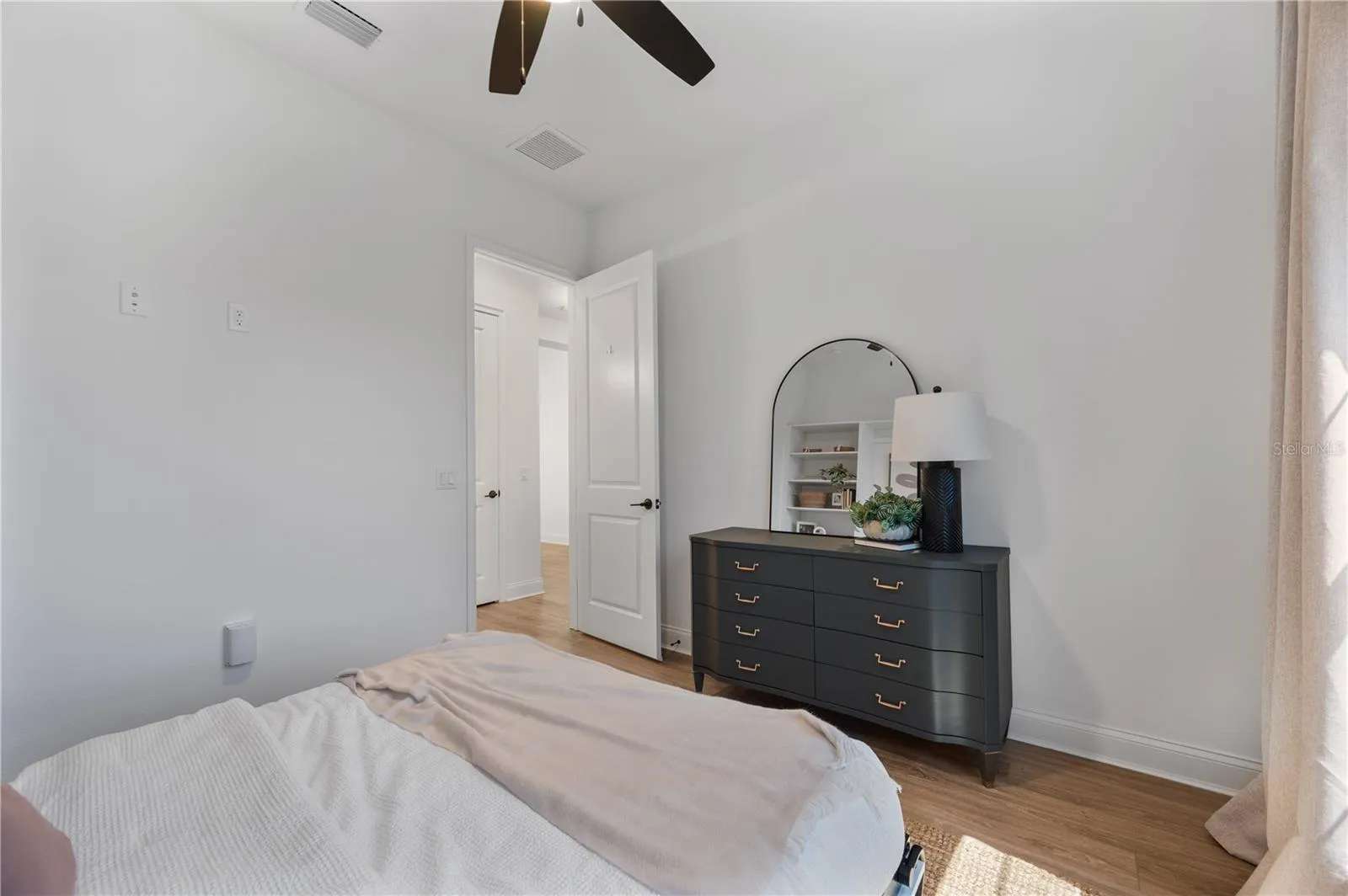 Custom built Murphy queen bed at front of home with built in storage system