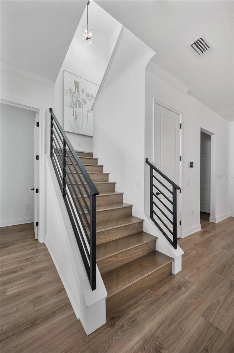 Stairs to upstairs loft and bedrooms