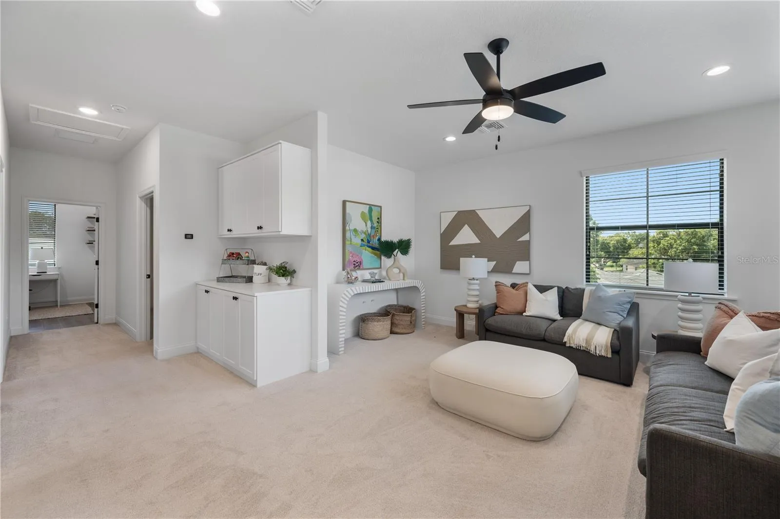 Upstairs loft that is pre-plumbed for a wet bar or can be drywalled in for an additional upstairs bedroom