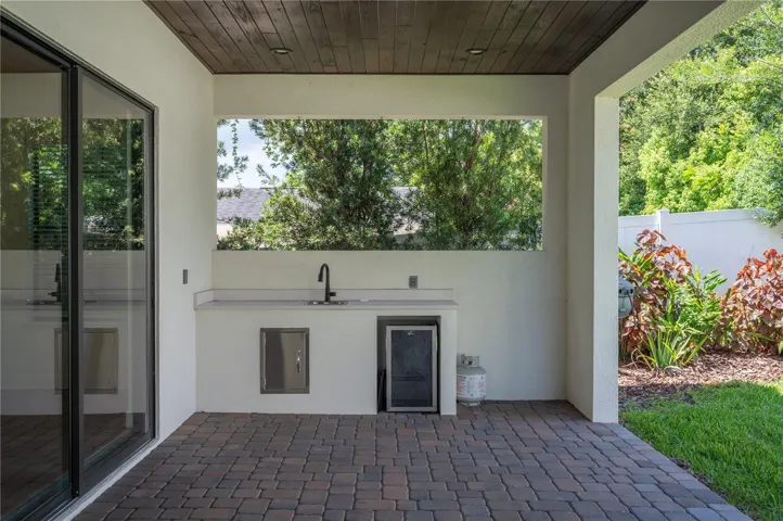 45ft paver lanai with stone fireplace and outdoor serving area