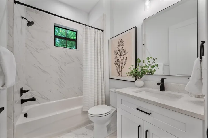 Downstairs full bathroom off entry