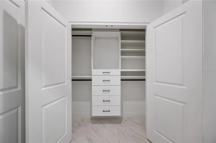 Second primary closet with California Closets system