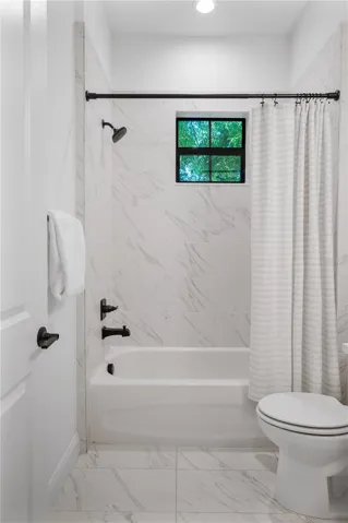 Downstairs full bathroom off entry