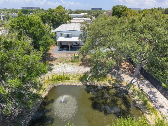 Aerial of Pond Behind Building
