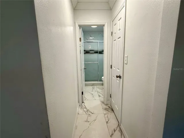 Hall in Master Bedroom to closet & bathroom
