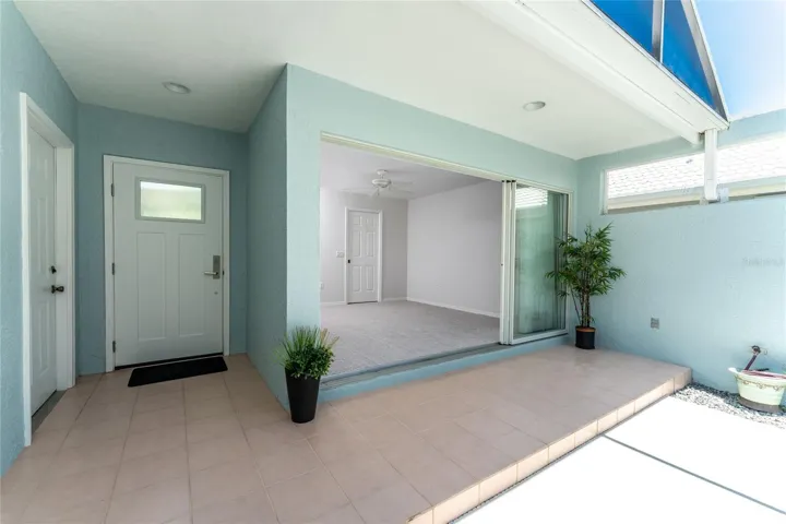 Front entrance leading to courtyard pool