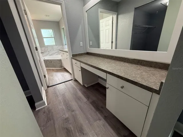 Primary bathroom separate makeup vanity area