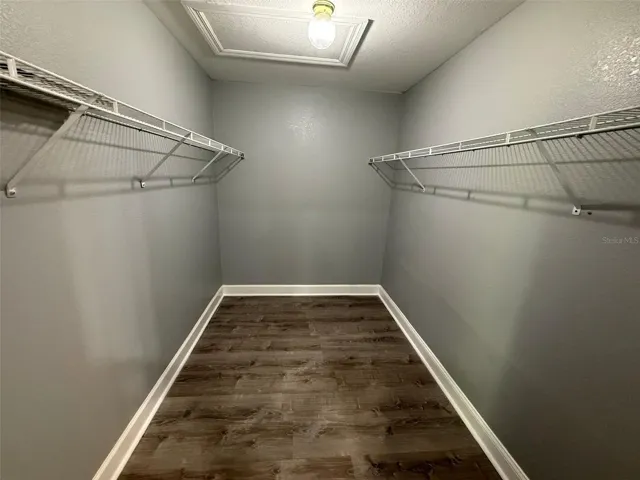 Primary bedroom walk in closet