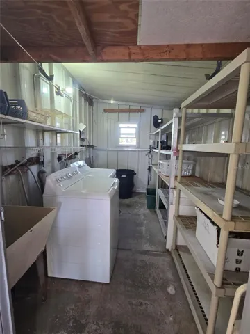 large shed with washer dryer &amp; utility sink