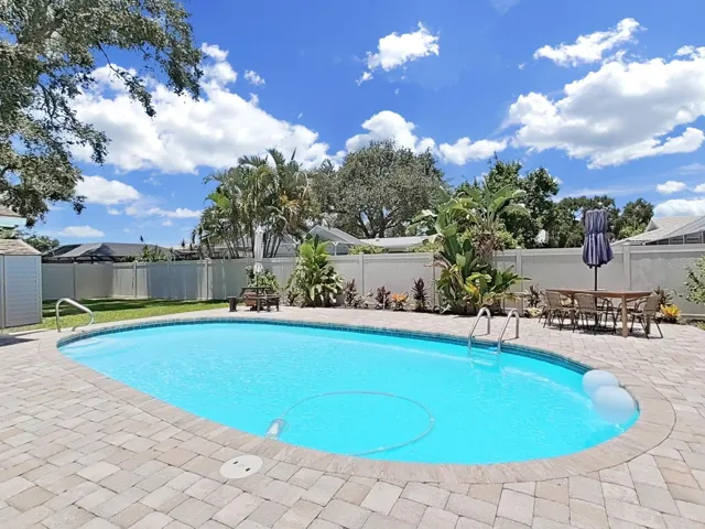 Your Backyard Oasis! Newly refinished sparkling pool with 20 year Clear-tec coating and new pool pump. Surrounded by 6 ft Vinyl privacy fence