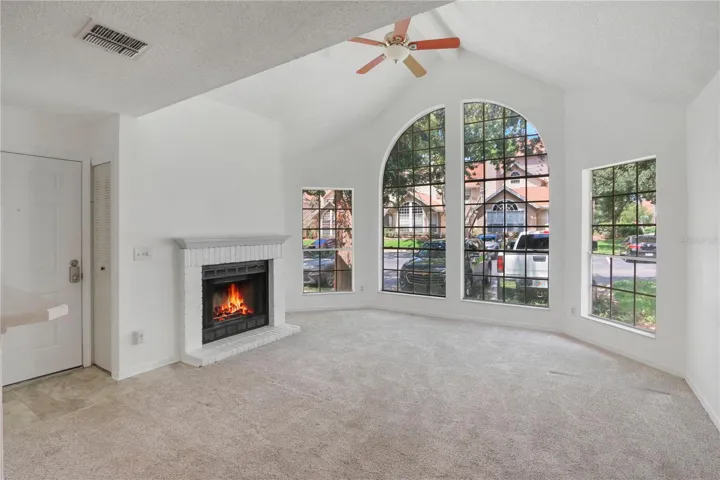 Living room with wood burning fireplace