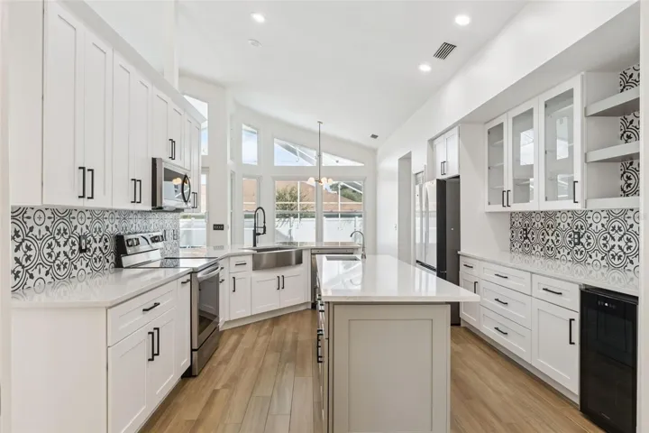 Kitchen with Custom Organizer Cabinets and Wine Refrigerator