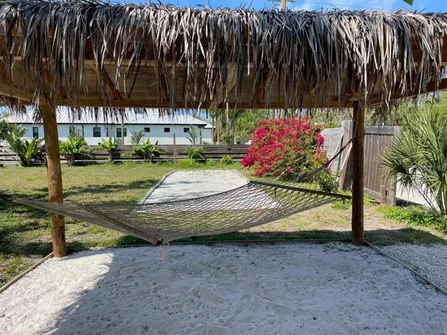 Tiki lounge area with hammock