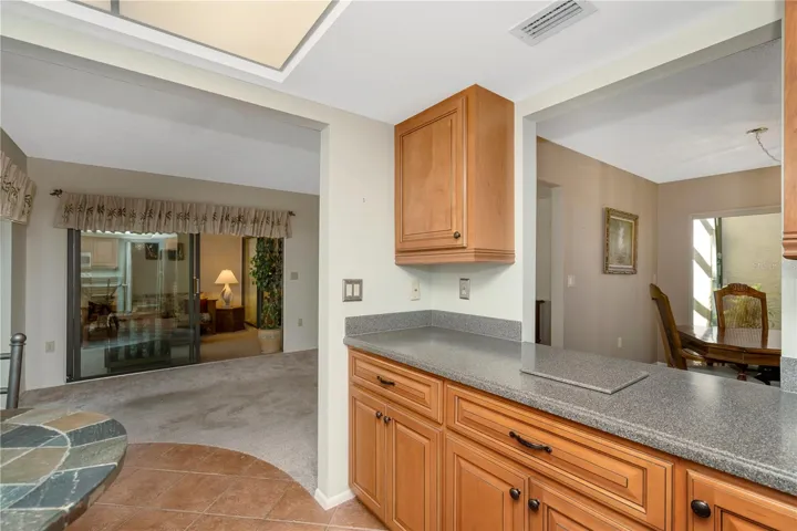Kitchen flowing into extra living space
